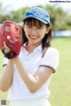 A woman in a baseball uniform holding a baseball glove.