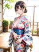 A woman in a kimono posing for a picture.